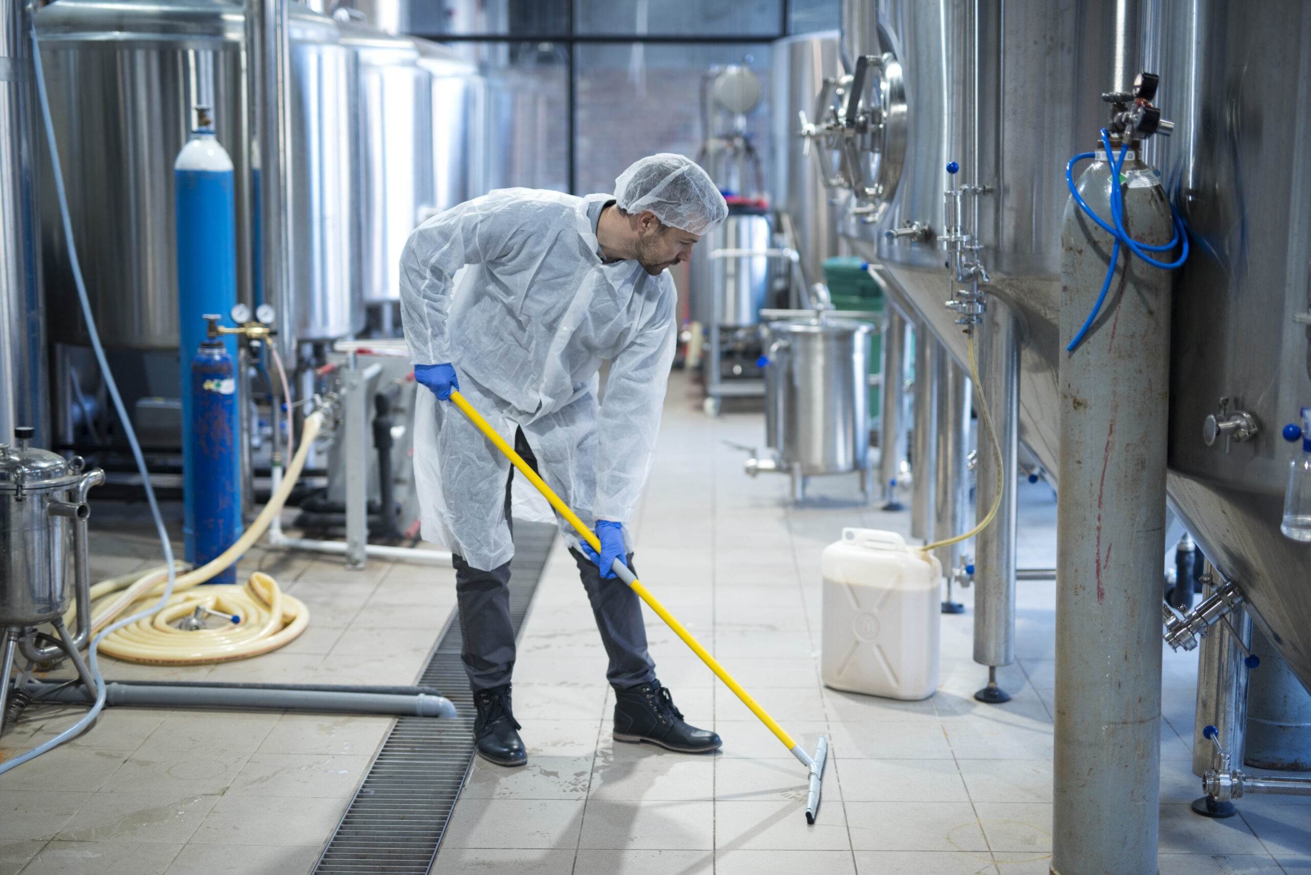 Specialist performing commercial mould removal in protective equipment