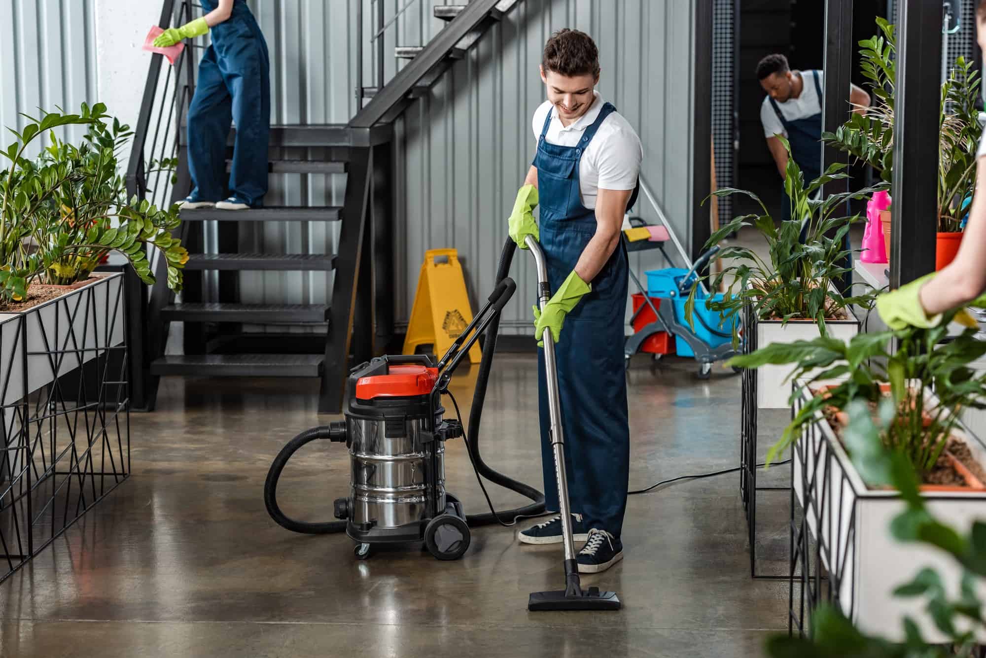 Professional cleaner mopping the floor of a gym and fitness centre in Canberra