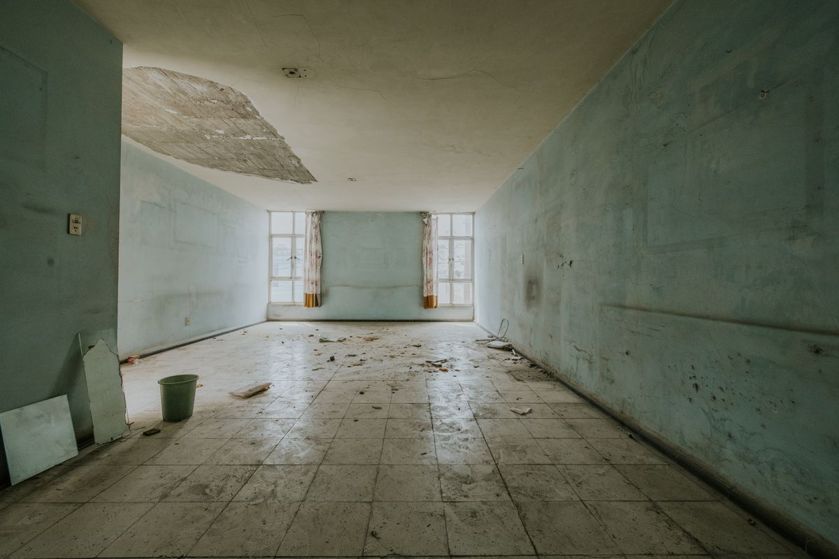 Damaged interior walls showing the effects of trapped moisture and deterioration
